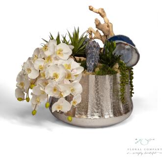 Draped Orchids in Silver Embellished Container with Blue Calcite - 27L x 18W x 21H Floral Arrangement