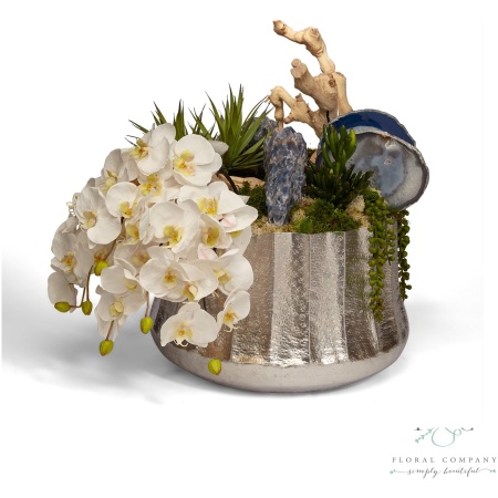 Draped Orchids in Silver Embellished Container with Blue Calcite - 27L x 18W x 21H Floral Arrangement